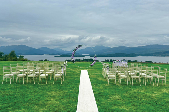 Outdoor wedding ceremony at Ardoch Loch Lomond with waterside views
